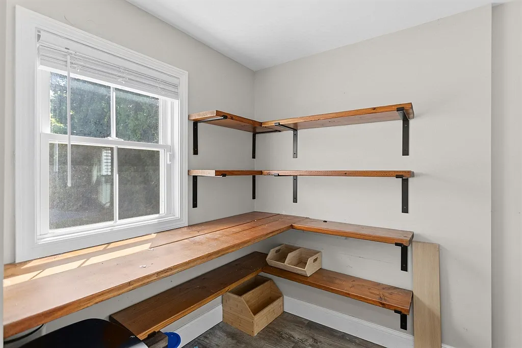 Small utility room with wood shelves and a matching work surface